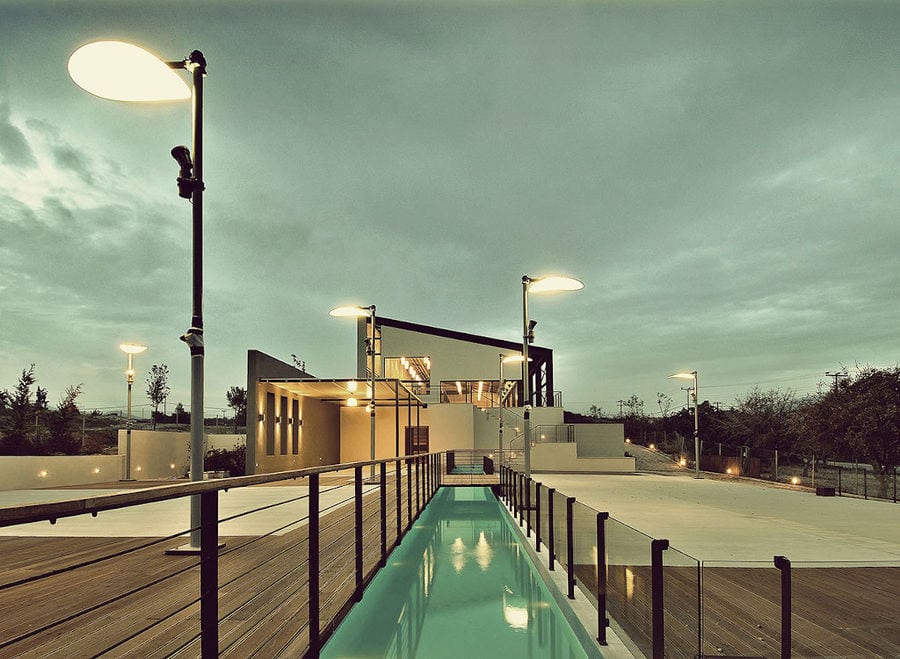 view of illuminated Domaine Papagiannakos winery by night, the building, the piscine